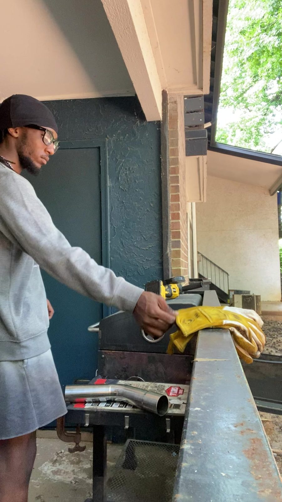 Deuce's welder fabricating a custom exhaust in the shop